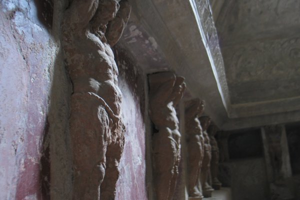 Statues on the walls of one of the houses