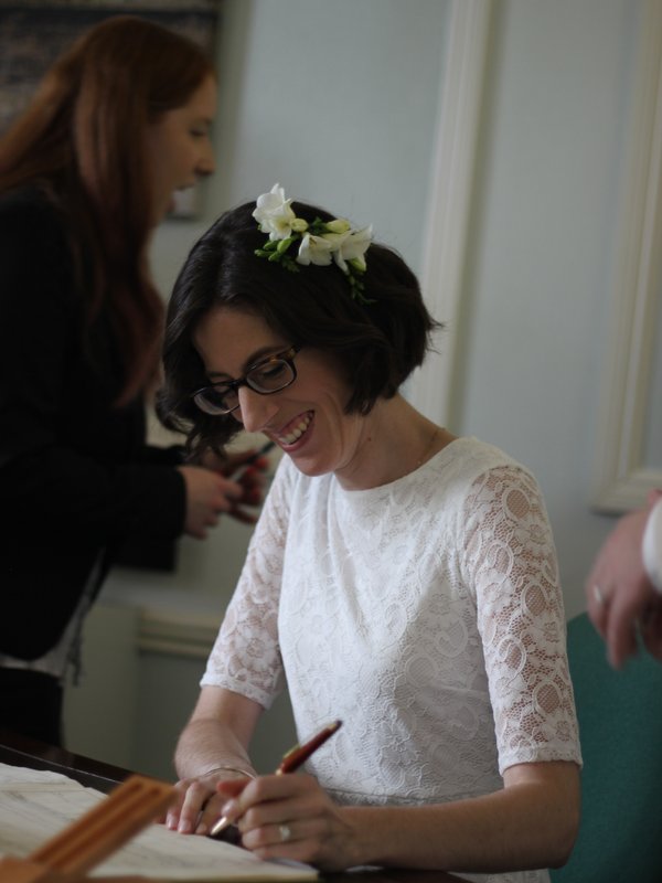 Christina signing the marriage certificate