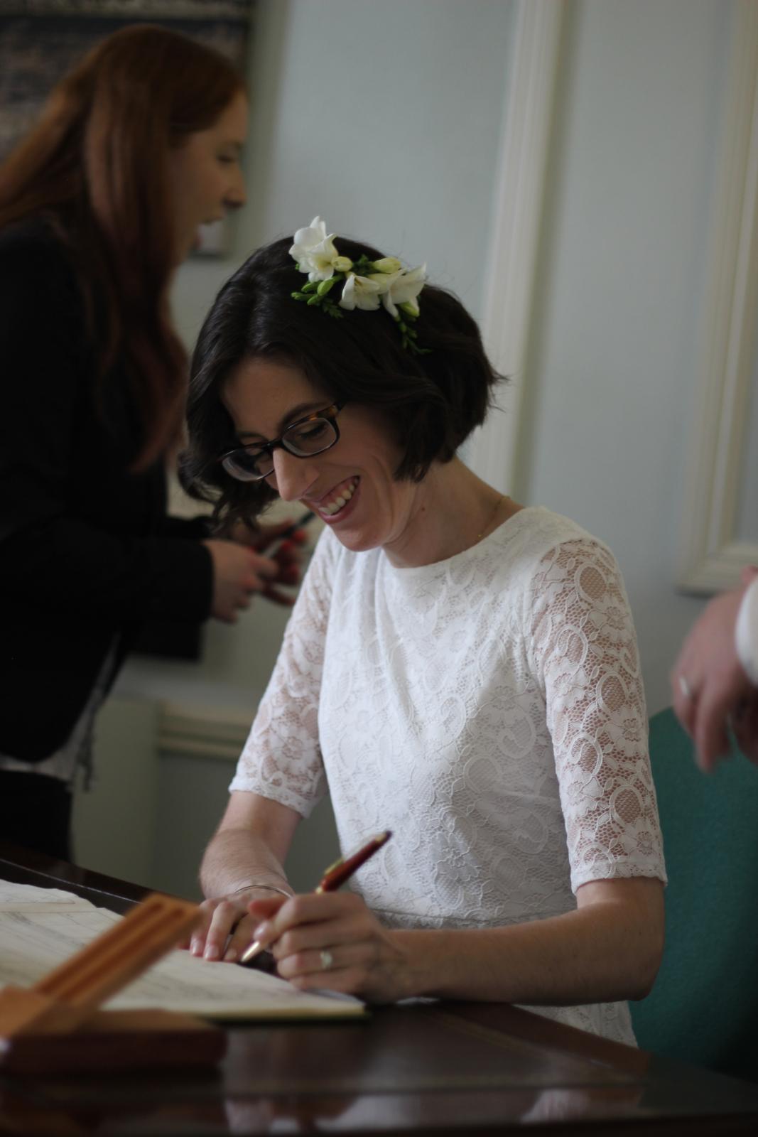 Christina signing the marriage certificate